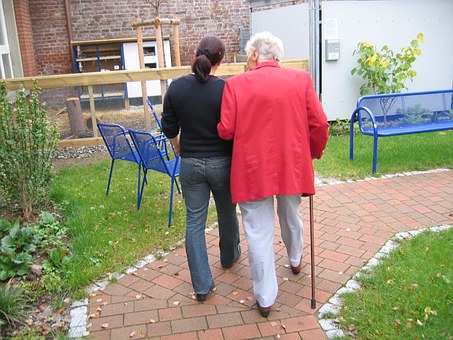 friendly staff when you choose care homes staff helping elderly lady